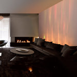 Dynamic water wave LED wall light glowing in dark room
